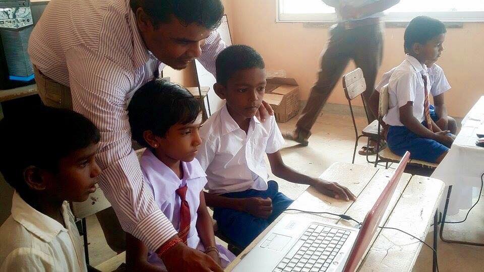 Care for Education - Children with Laptop