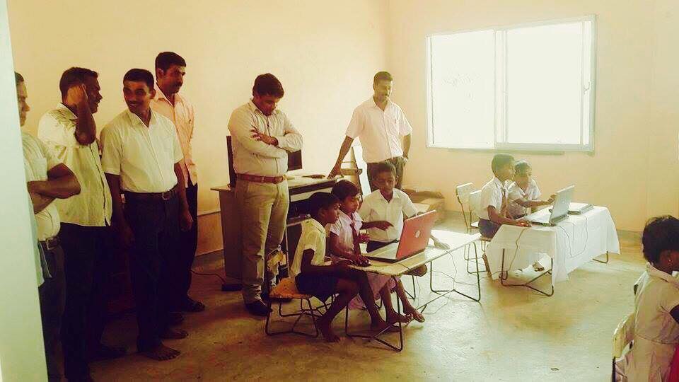 Care for Education - Children with Laptop