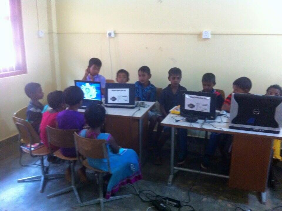 Care for Education - Children with Laptop