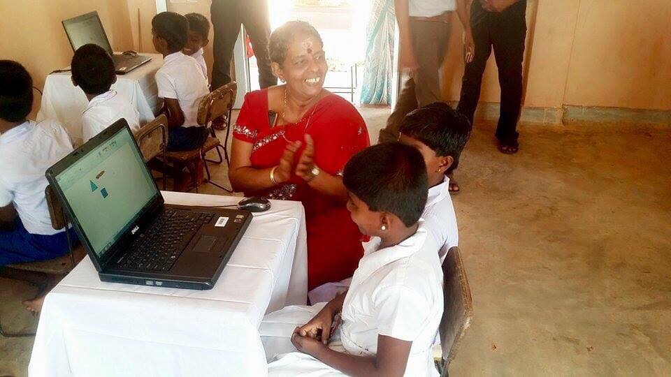 Care for Education - Children with Laptop