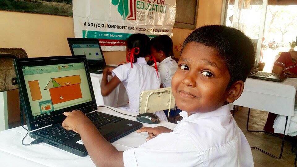 Care for Education - Children with Laptop